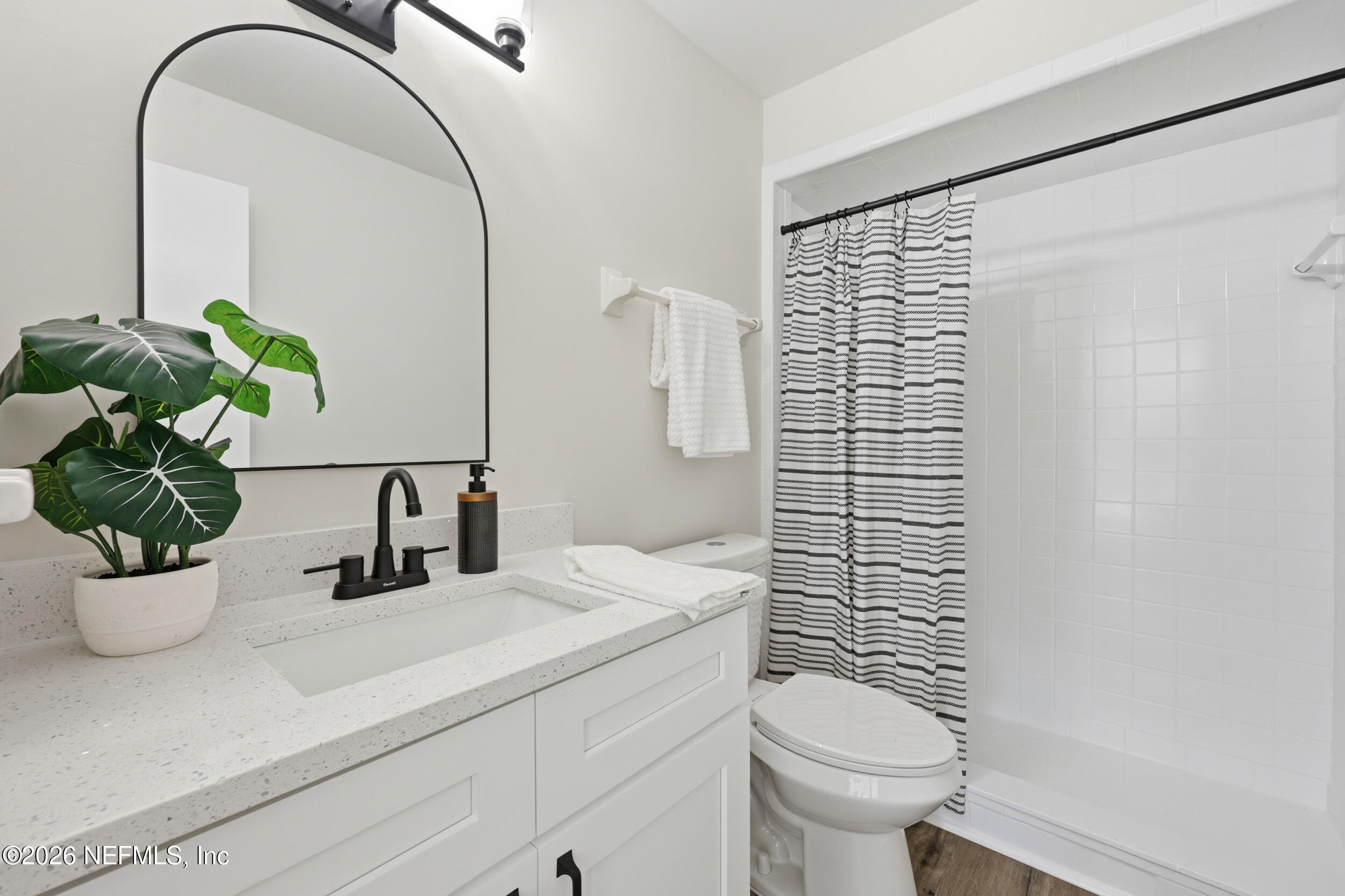 2171 Carter Braxton Road Orange Park, FL 32073 - Photo 8 of 39 a bathroom with a sink a toilet and a mirror