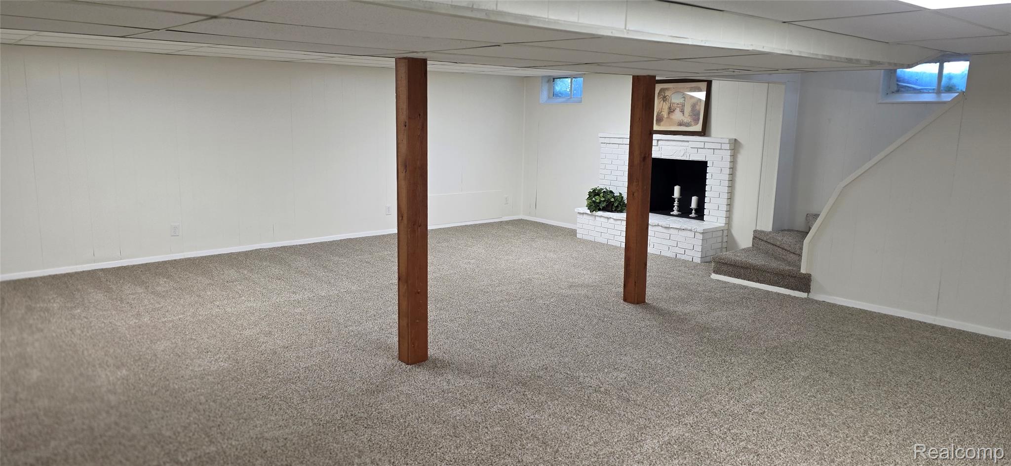 4363 West Dodge Road Clio, MI 48420 - Photo 34 of 52 Spacious finished basement featuring light gray carpeting and white paneled walls