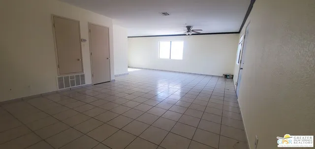 a view of an empty room and window