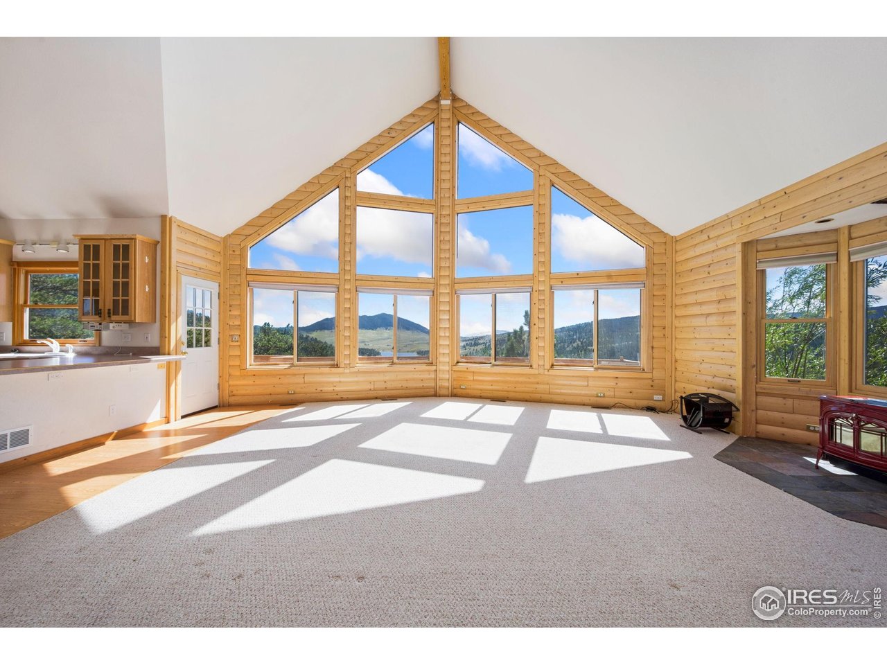 965 Stone Mountain Ranch Road Loveland, CO 80537 - Photo 11 of 49 Floor to ceiling windows to take in all of Colorado