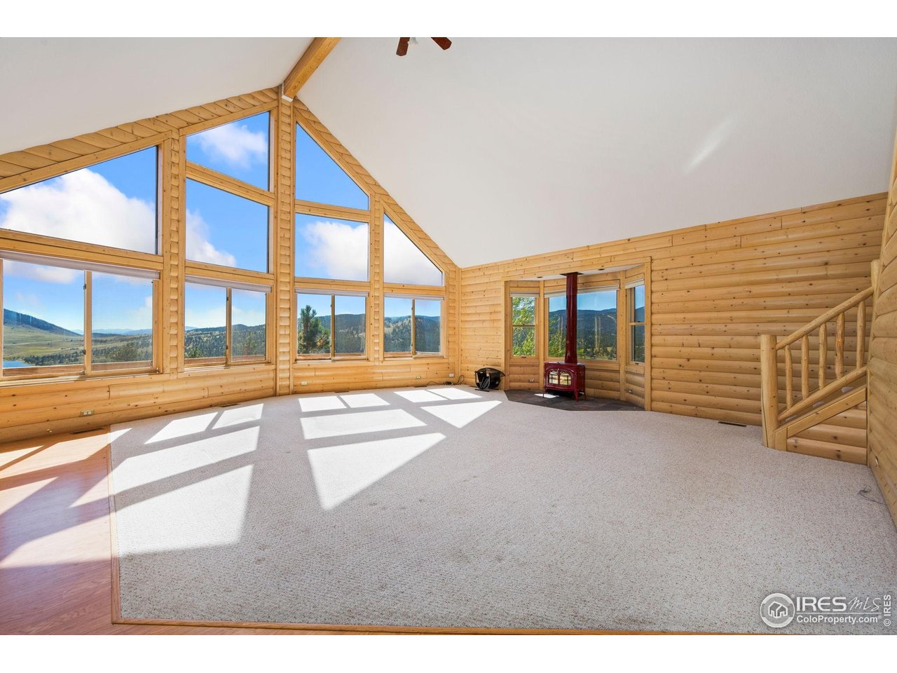965 Stone Mountain Ranch Road Loveland, CO 80537 - Photo 12 of 49 Vaulted ceilings enrich the space