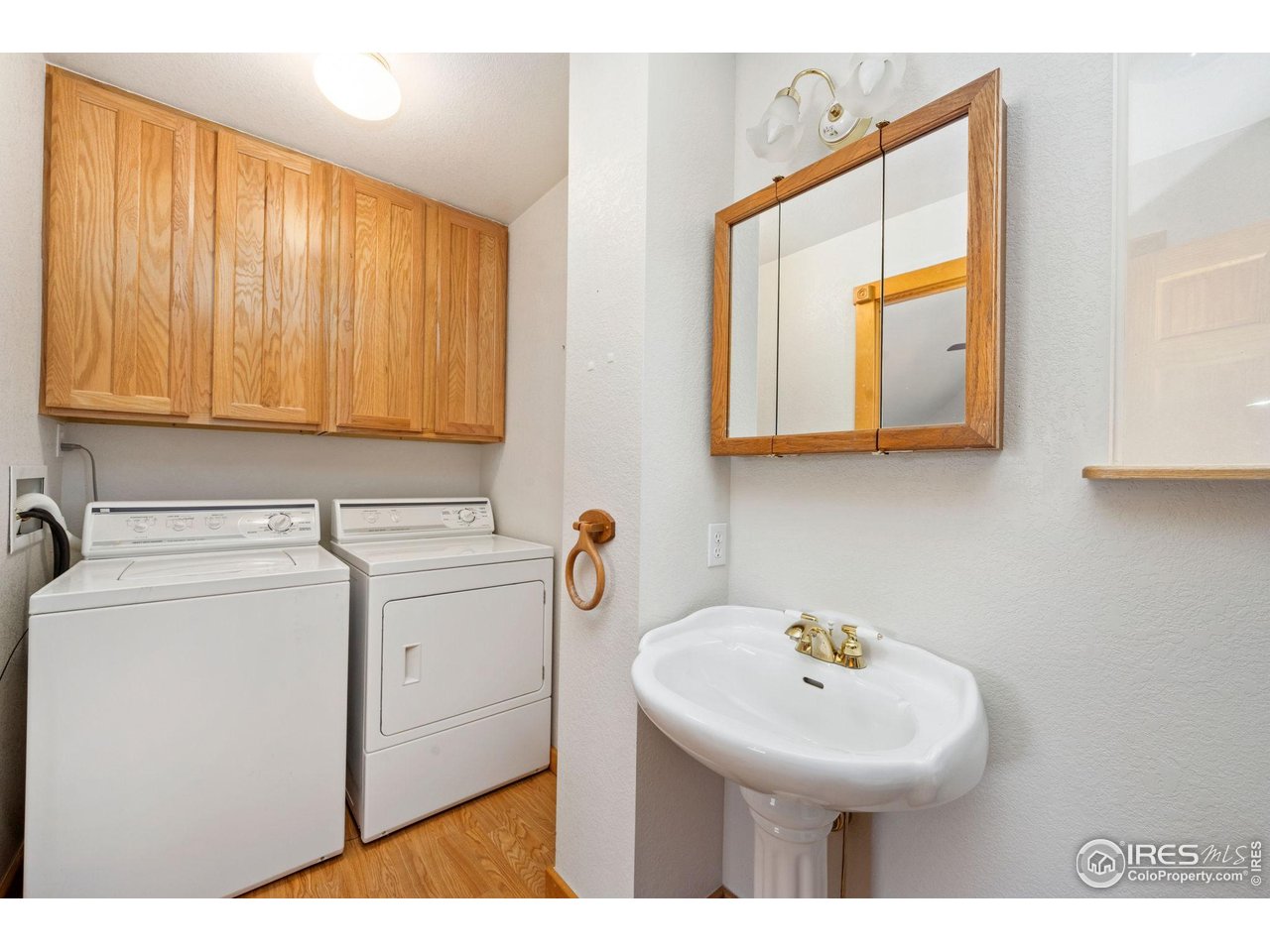 965 Stone Mountain Ranch Road Loveland, CO 80537 - Photo 32 of 49 Upstairs Laundry and bathroom