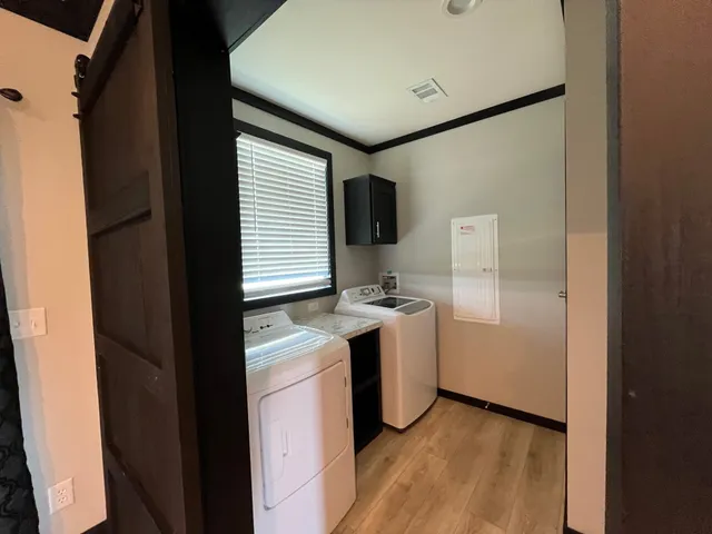 a kitchen with a refrigerator and a stove