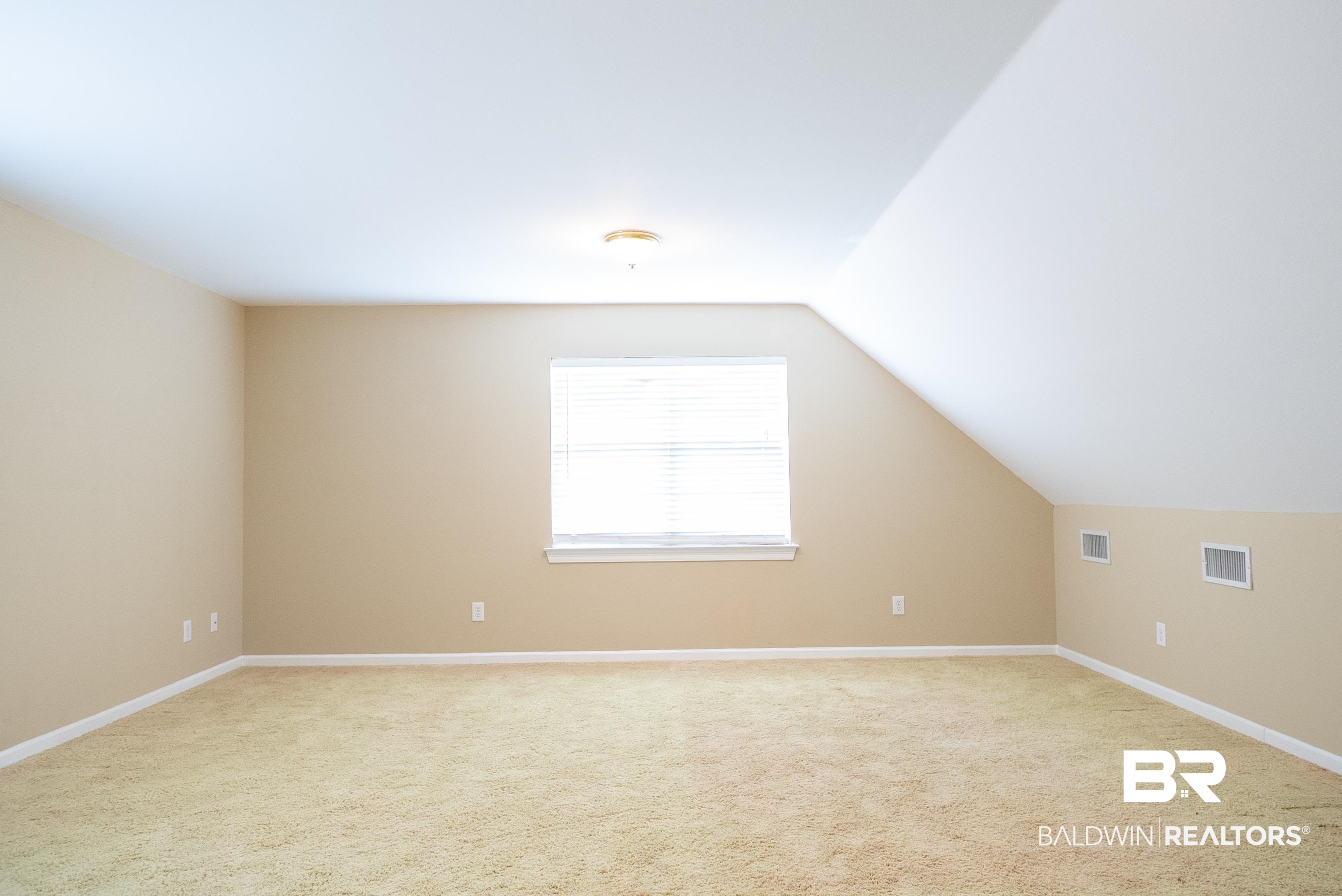 10023 Springfield Court Mobile, AL 36695 - Photo 39 of 50 Bonus room featuring light carpet and lofted ceiling
