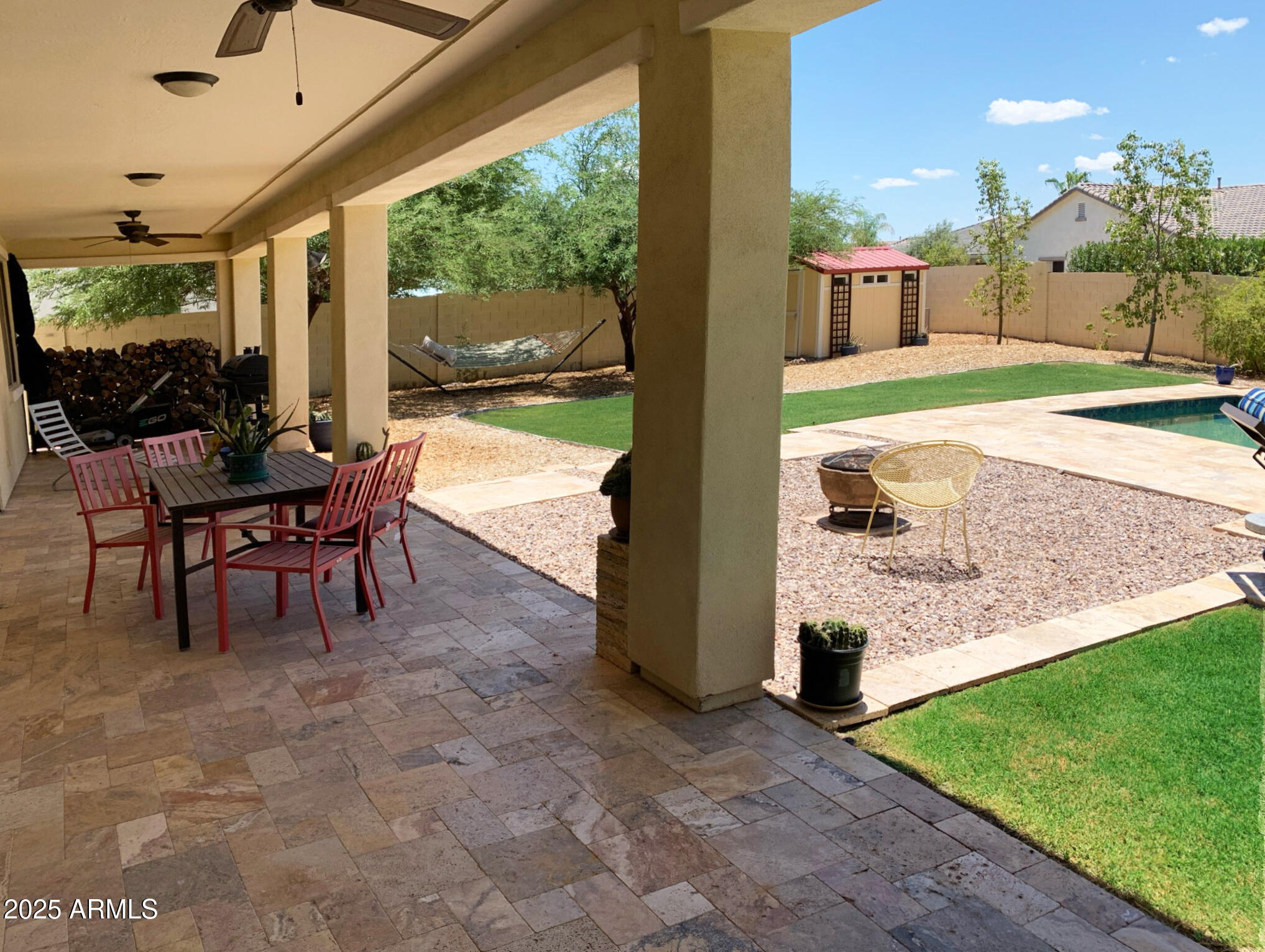 4836 South Covalent Lane Mesa, AZ 85212 - Photo 16 of 66 a view of a porch with chairs and backyard