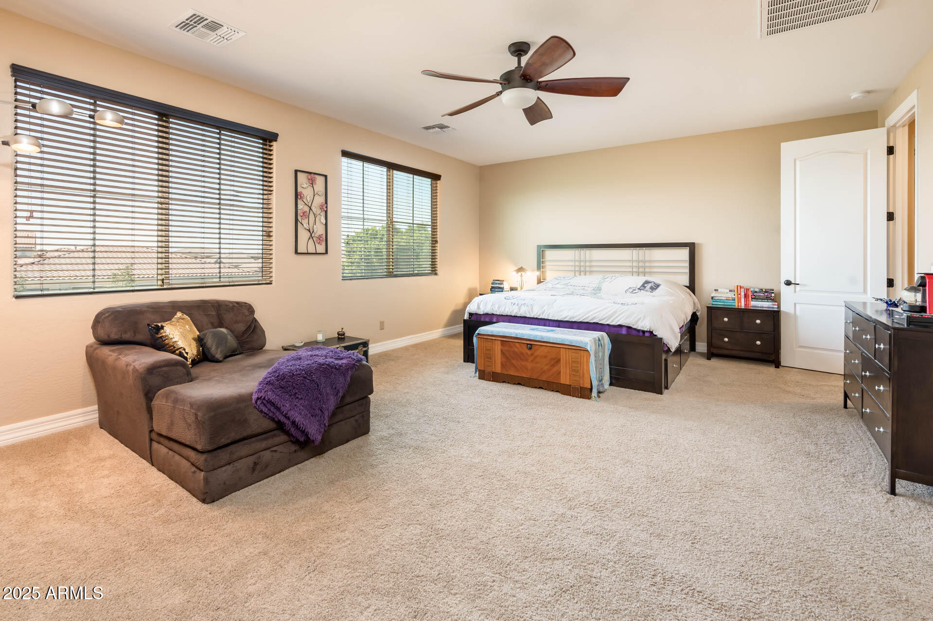 4836 South Covalent Lane Mesa, AZ 85212 - Photo 19 of 66 a spacious bedroom with a bed couch and window