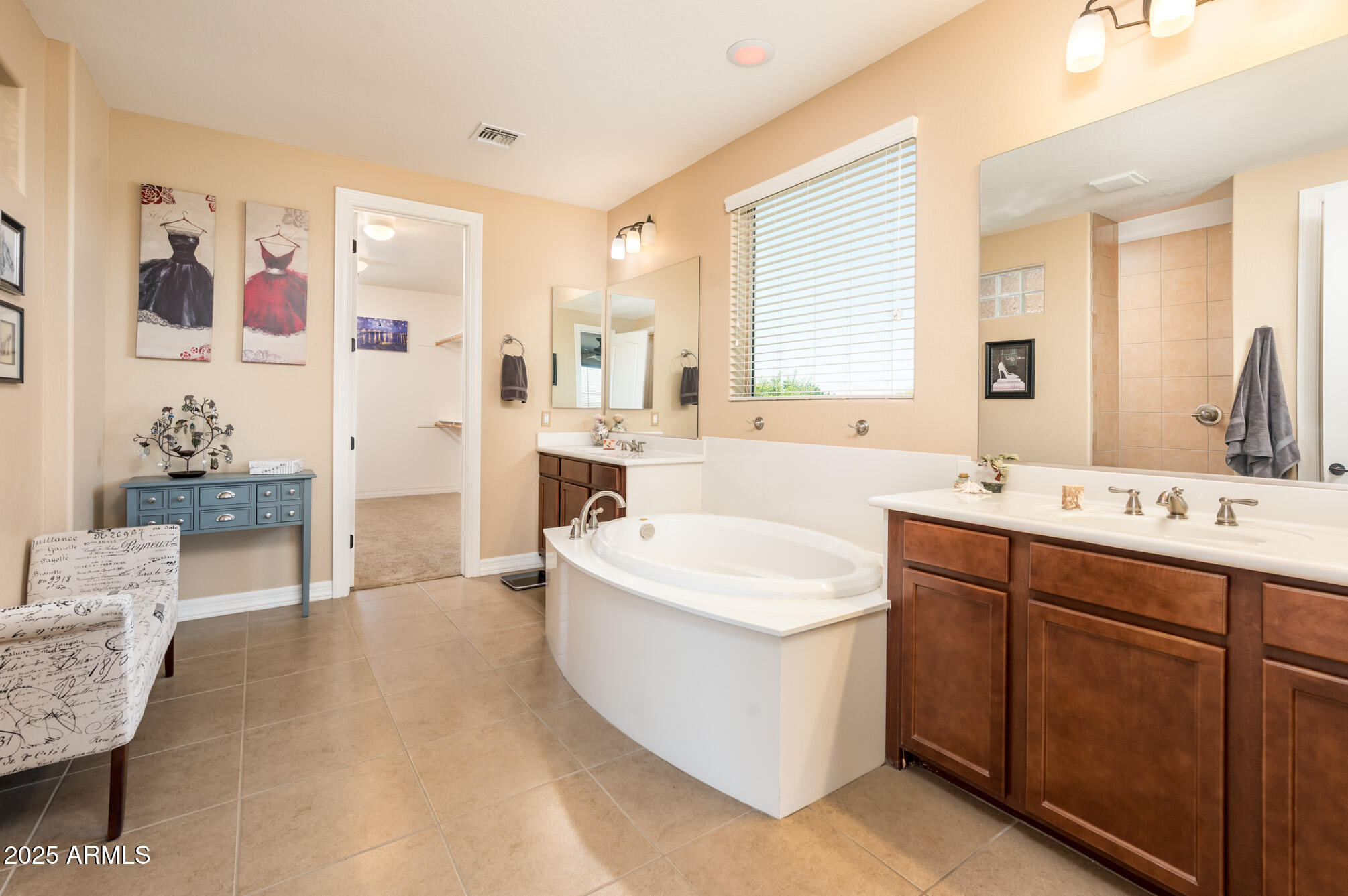4836 South Covalent Lane Mesa, AZ 85212 - Photo 21 of 66 a spacious bathroom with a tub sink and mirror