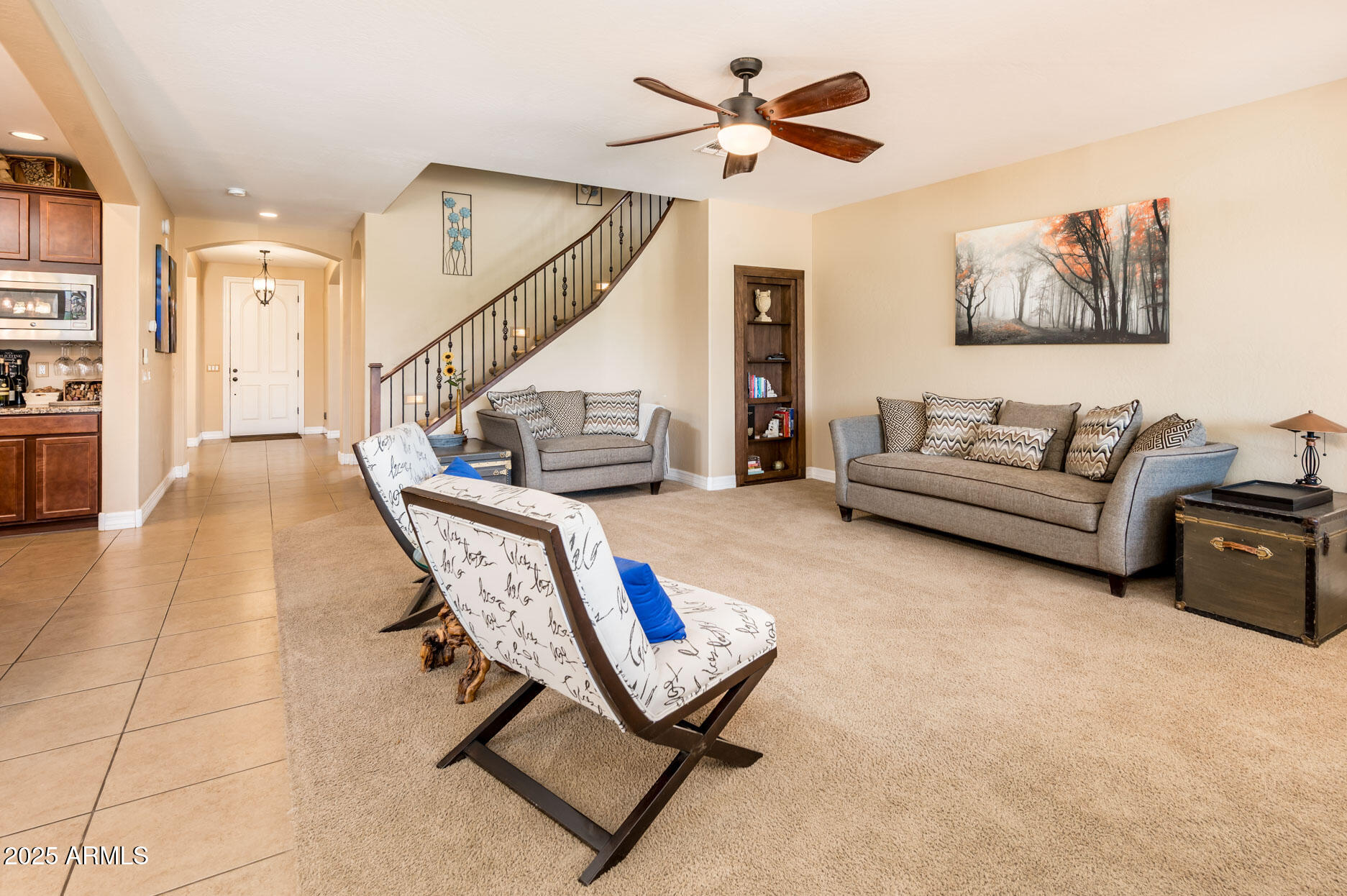 4836 South Covalent Lane Mesa, AZ 85212 - Photo 25 of 66 a living room with furniture and a ceiling fan