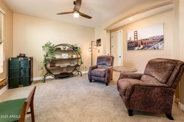 a bed room with two bed and a dresser