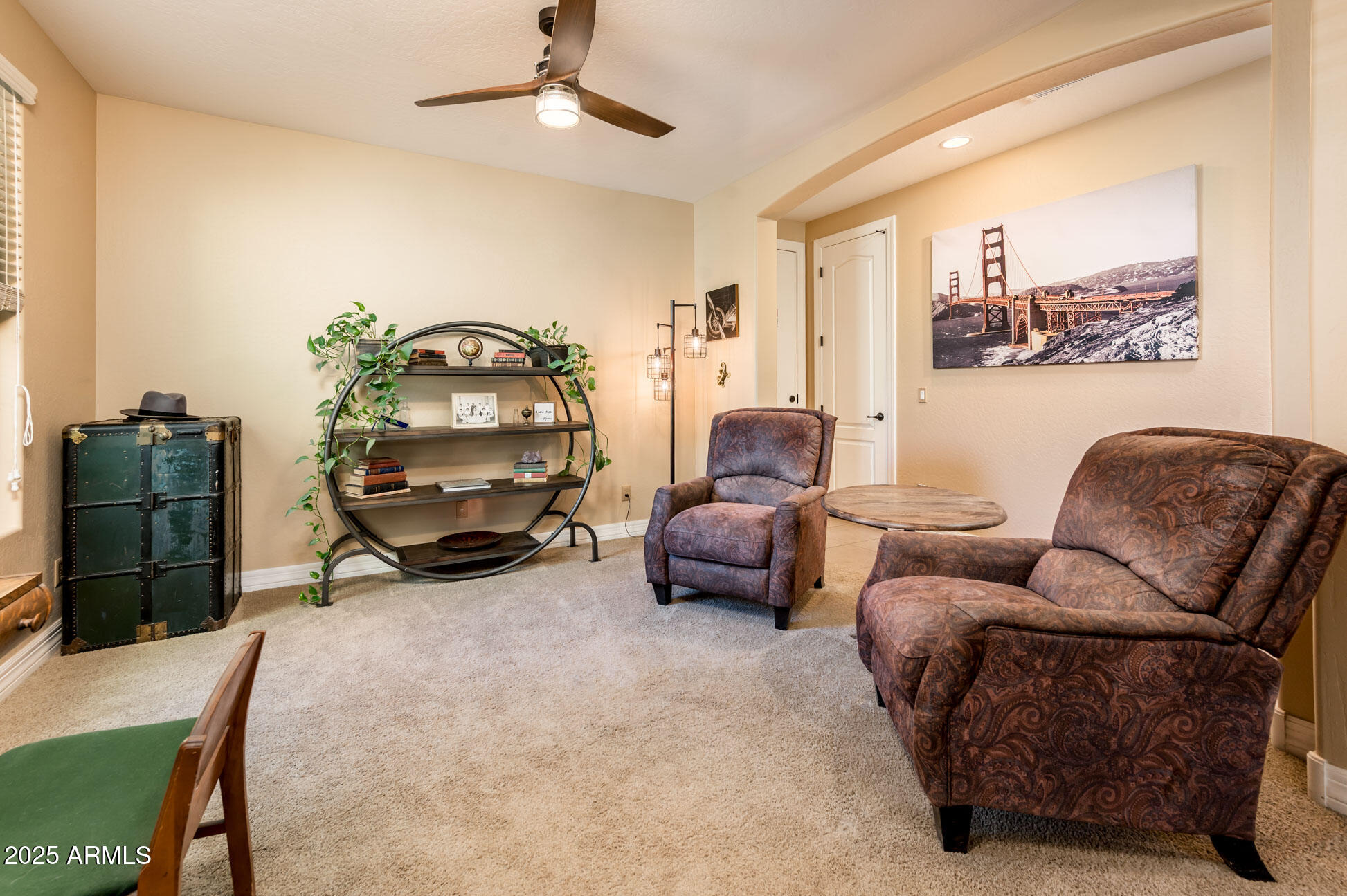 4836 South Covalent Lane Mesa, AZ 85212 - Photo 30 of 66 a living room with furniture a couch and a potted plant