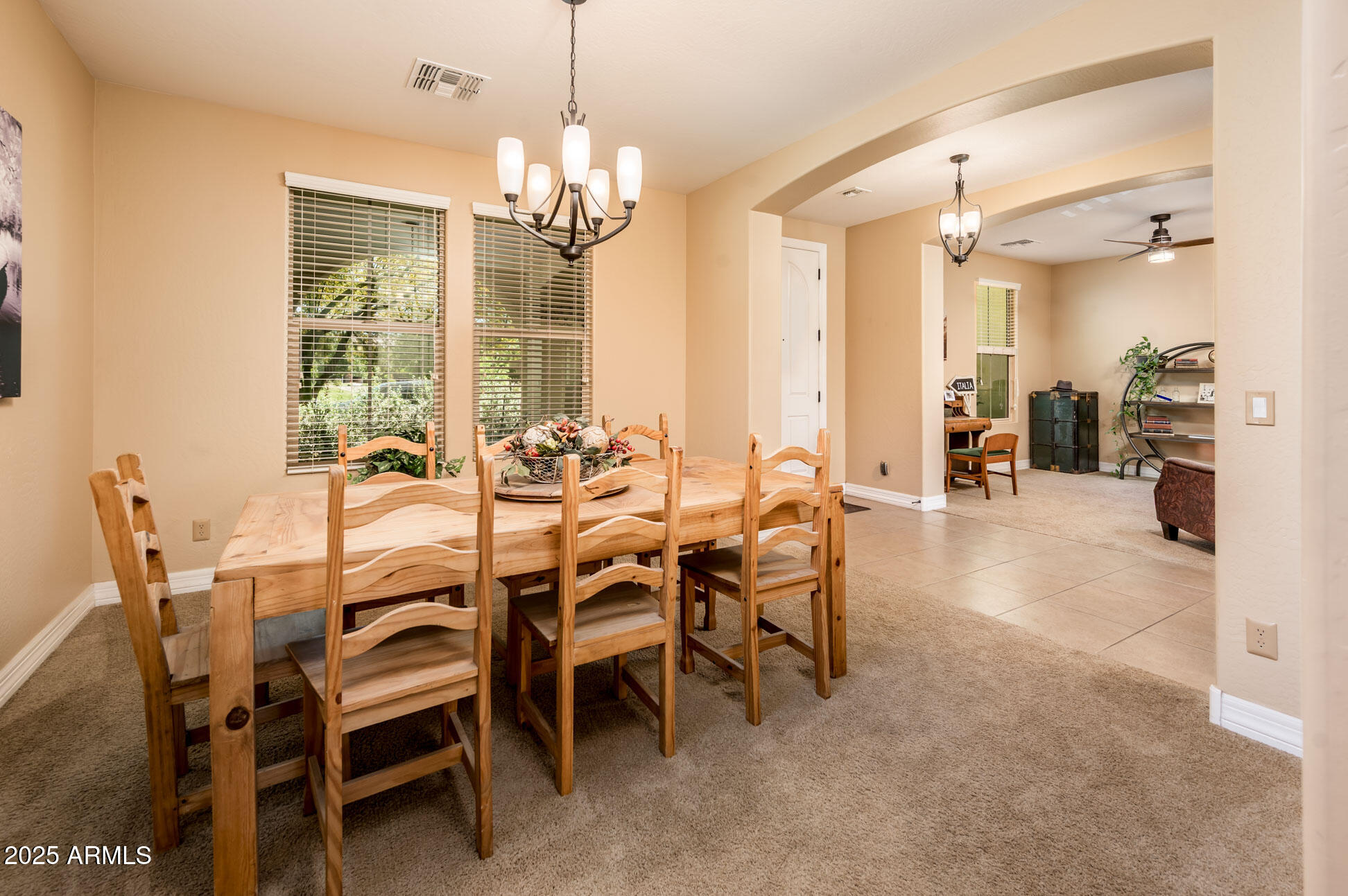 4836 South Covalent Lane Mesa, AZ 85212 - Photo 32 of 66 a view of a dining room with furniture and chandelier