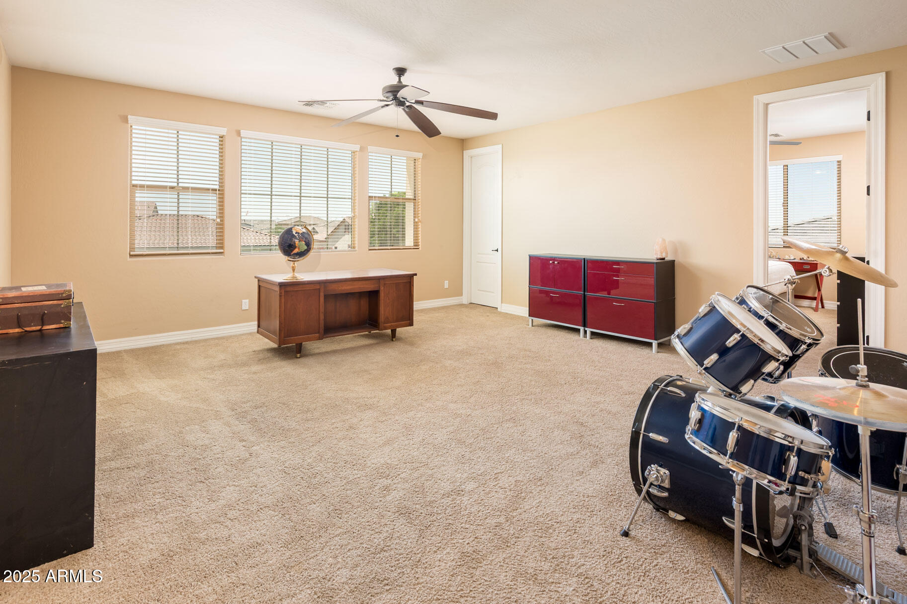 4836 South Covalent Lane Mesa, AZ 85212 - Photo 37 of 66 a bedroom with furniture and a window