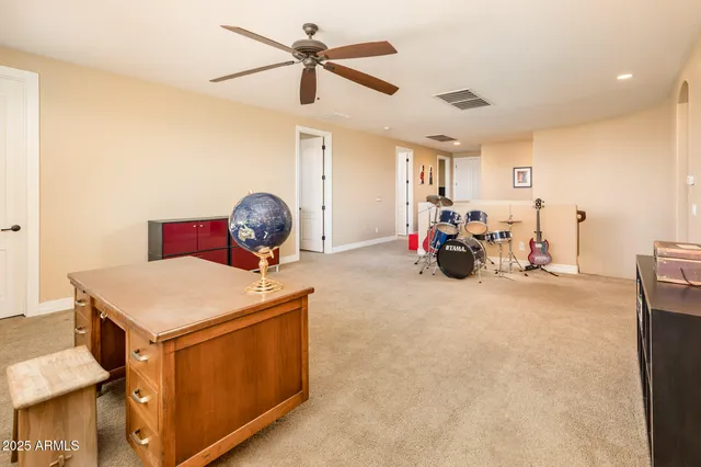 a livingroom with workspace and a couch