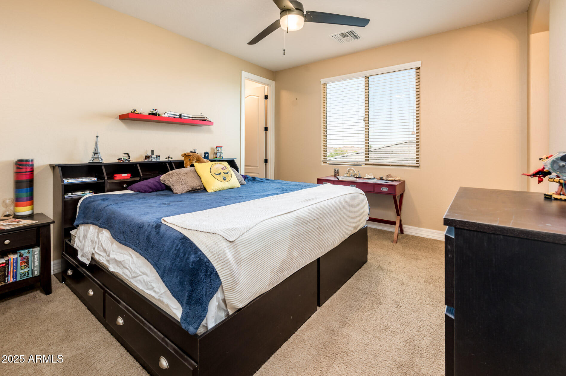 4836 South Covalent Lane Mesa, AZ 85212 - Photo 39 of 66 a bedroom with a bed and a chandelier