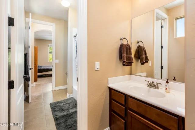 a utility room with dryer washer and a view of living room