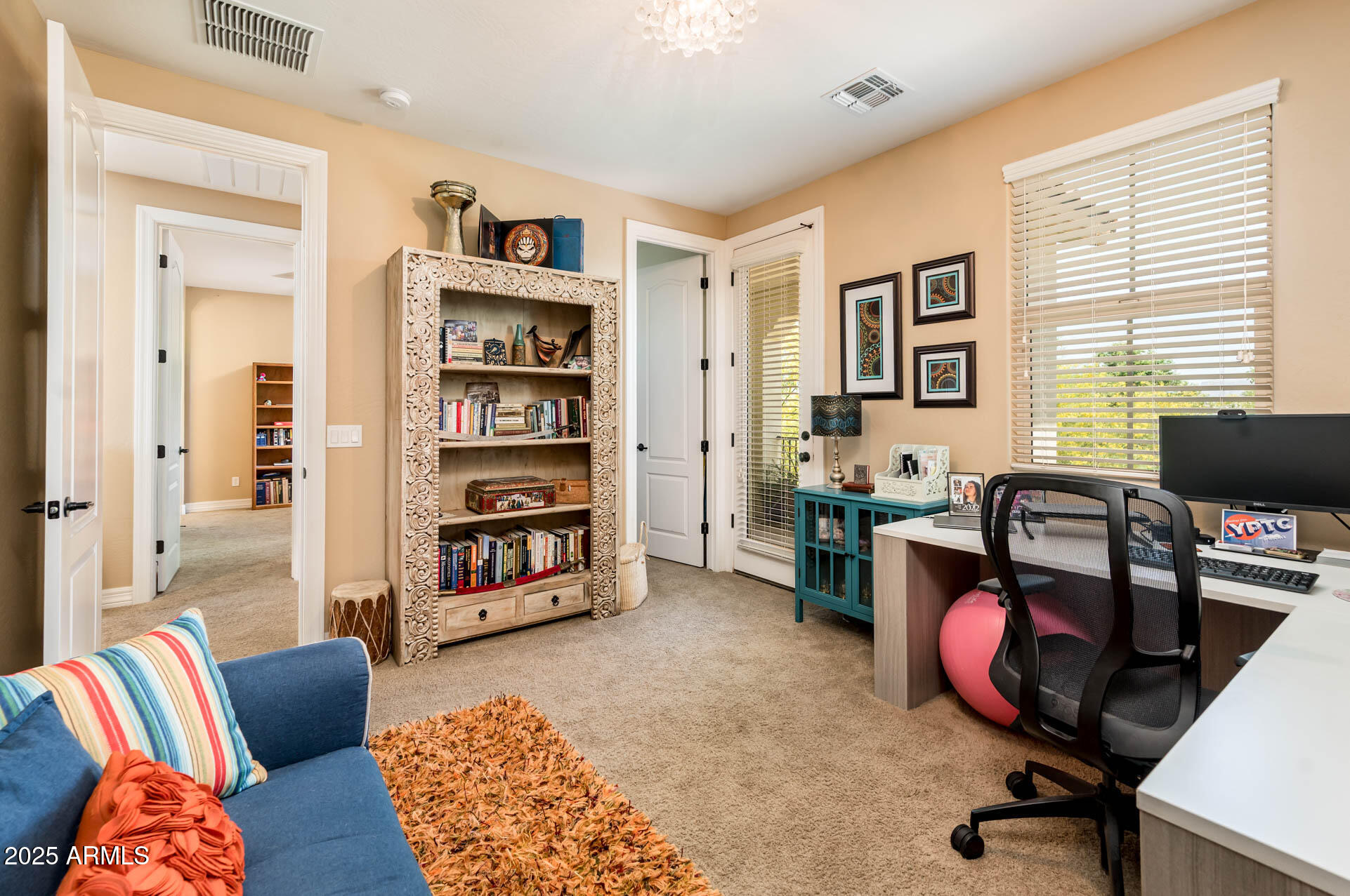 4836 South Covalent Lane Mesa, AZ 85212 - Photo 48 of 66 a livingroom with workspace and a couch