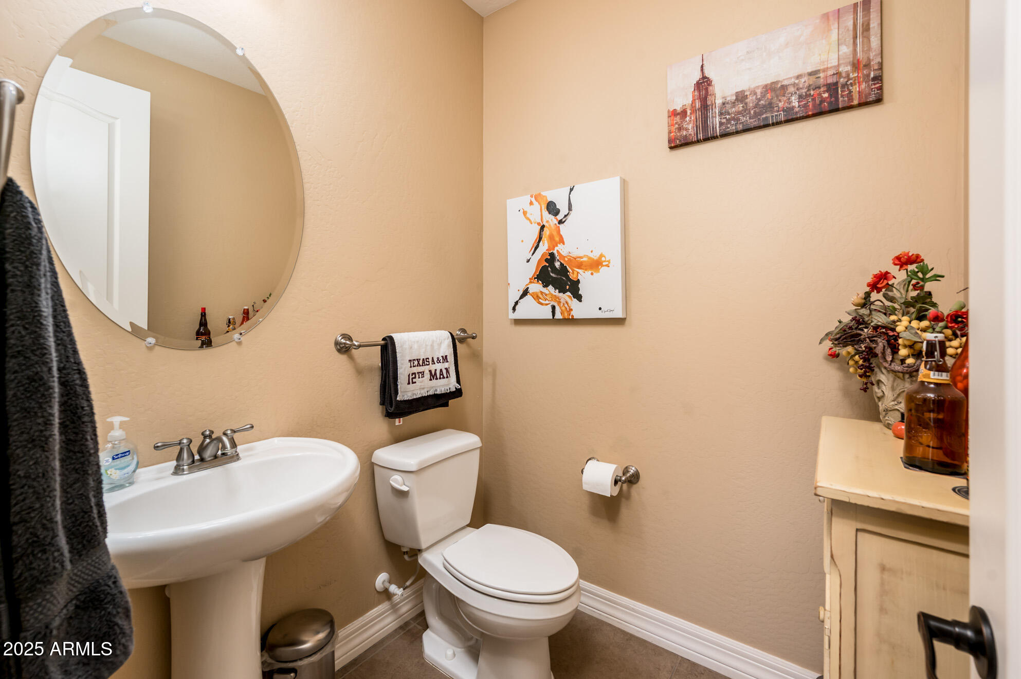 4836 South Covalent Lane Mesa, AZ 85212 - Photo 56 of 66 a bathroom with a toilet sink and mirror