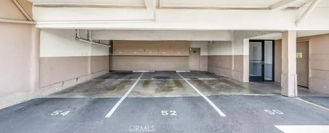 a view of a room with shelves on the wall