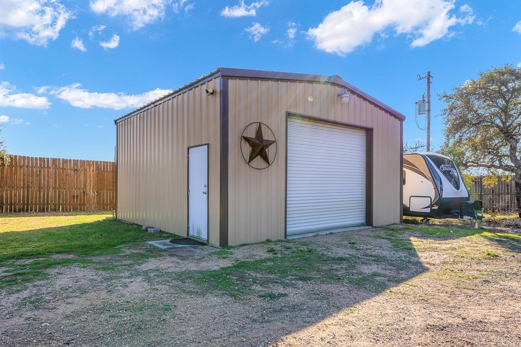 116 Miramar Circle Weatherford, TX 76085 - Photo 23 of 37 View of 25x25 insulated air conditioned workshop with 8x25 loft for storage