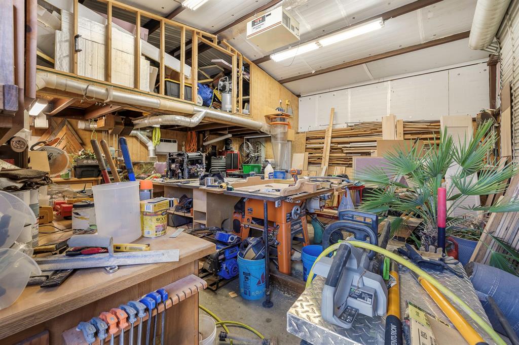 116 Miramar Circle Weatherford, TX 76085 - Photo 24 of 37 Virtually staged / cleaned up and emptied 25x25 electric, insulated and air-conditioned workshop with 8x25 loft for storage