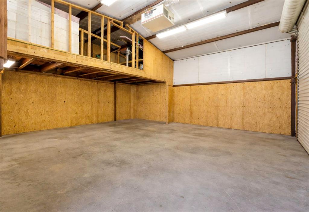 116 Miramar Circle Weatherford, TX 76085 - Photo 25 of 37 Virtually staged / cleaned up and emptied 25x25 electric, insulated and air-conditioned workshop with 8x25 loft for storage