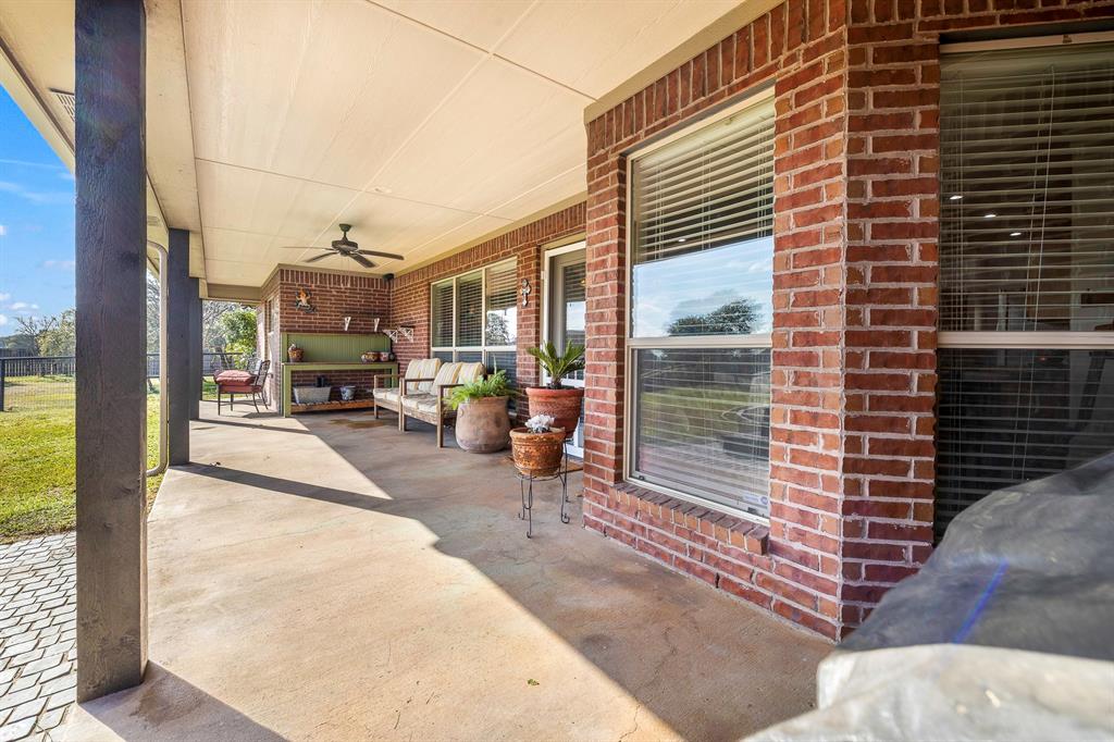 116 Miramar Circle Weatherford, TX 76085 - Photo 28 of 37 View of back patio / terrace featuring stained concrete flooring and ceiling fan and an outdoor living space that is steps away from pool, deck and pergola