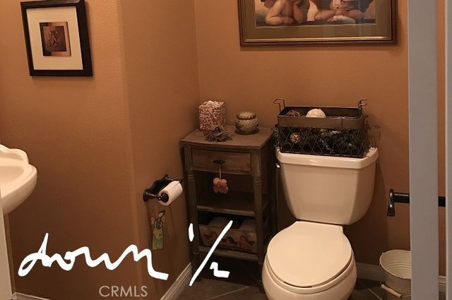 a bathroom with a toilet and a sink