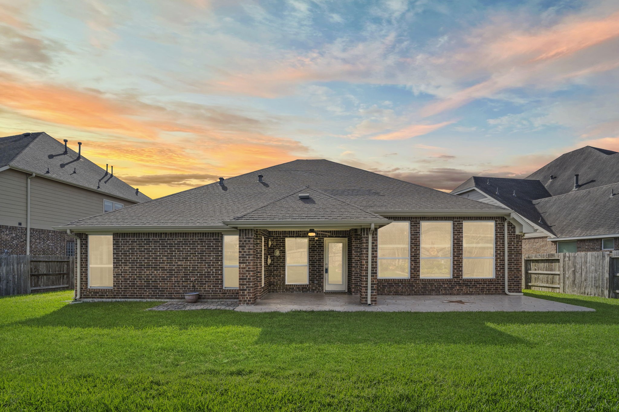 3426 Summer Ranch Drive Katy, TX 77494 - Photo 35 of 48 Enjoy evenings under the covered patio as the backyard transforms into a peaceful setting, perfect for unwinding or hosting friends and family.