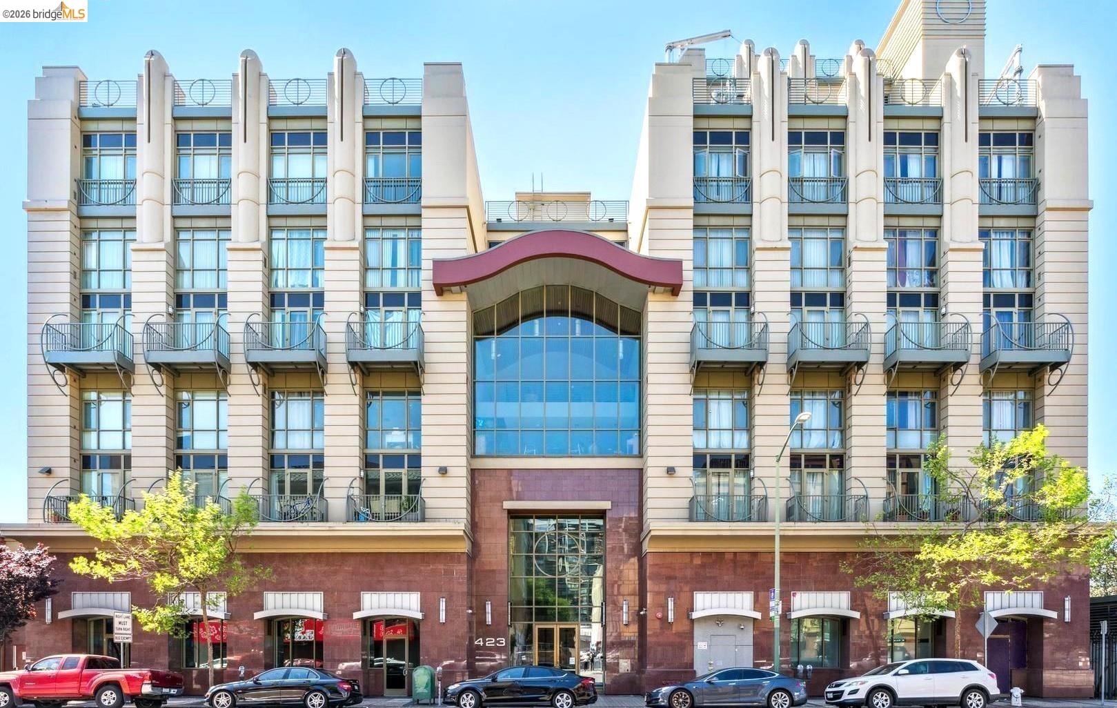 423 7th Street, Unit 303 Oakland, CA 94607 - Photo 1 of 19 a front view of a multi story building