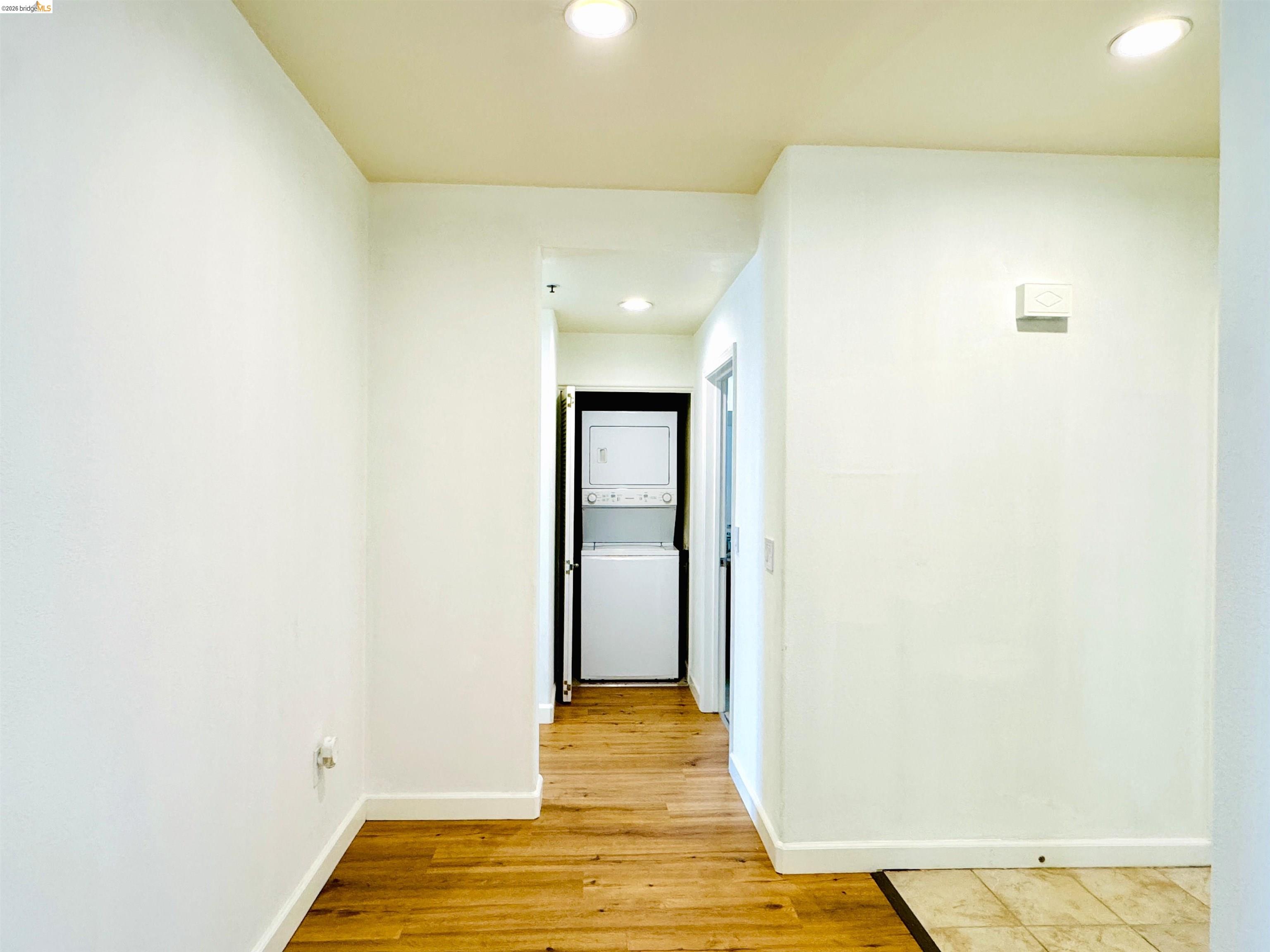 423 7th Street, Unit 303 Oakland, CA 94607 - Photo 15 of 19 a view of a room with wooden floor