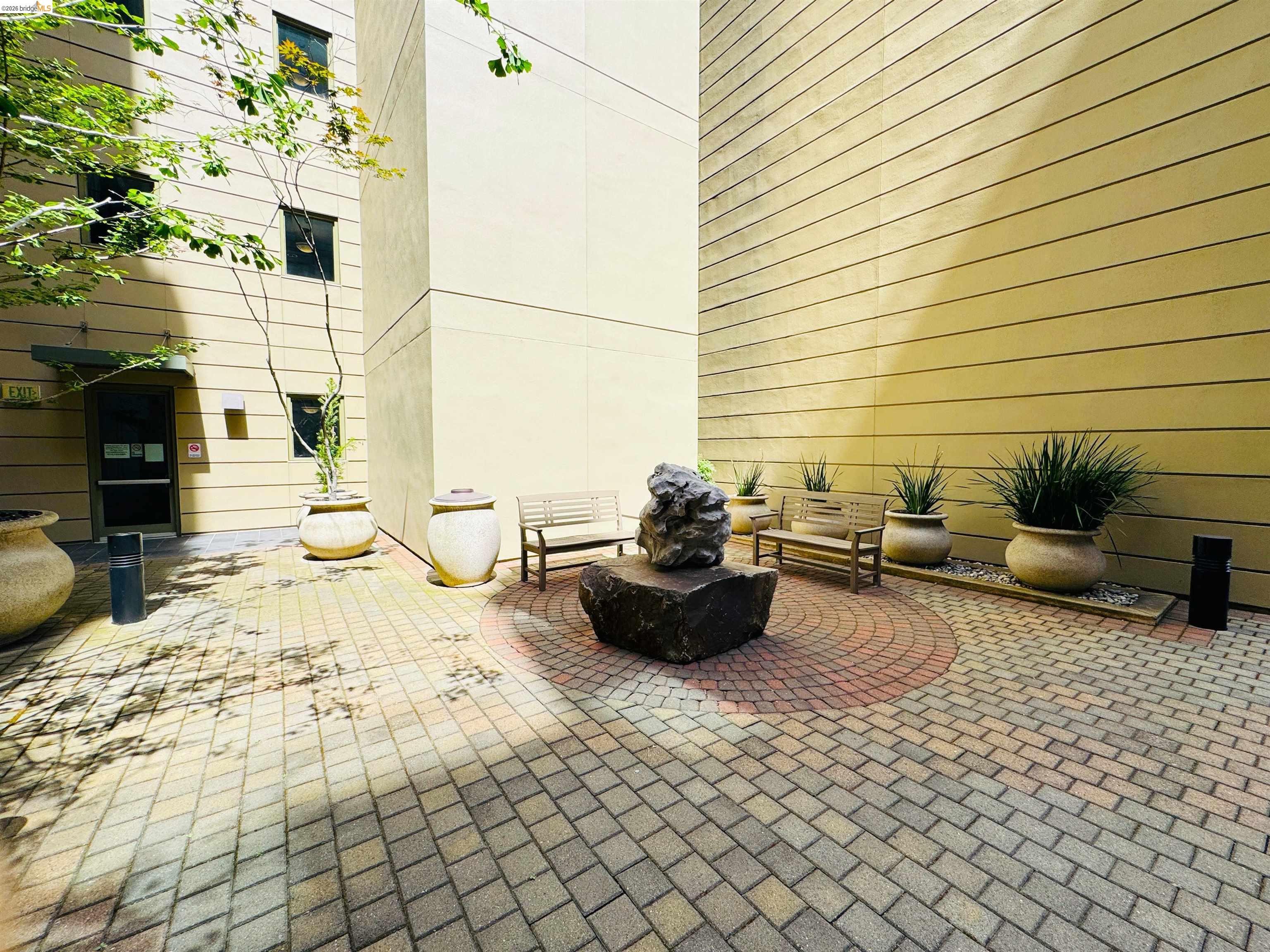 423 7th Street, Unit 303 Oakland, CA 94607 - Photo 6 of 19 a living room with furniture