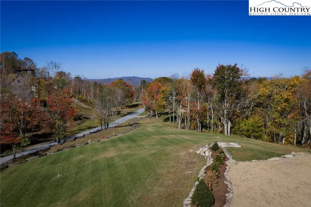 a view of a road with a yard