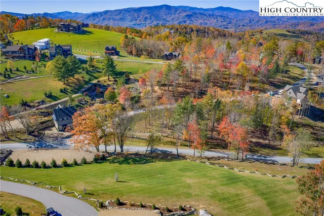 a view of a city with mountains in the background