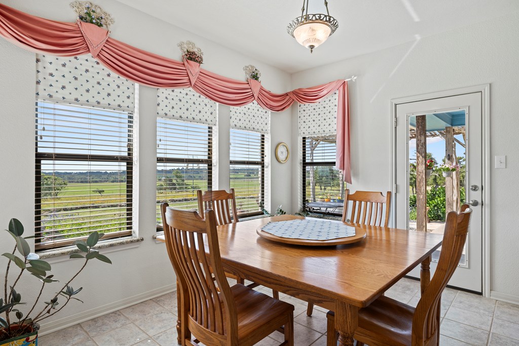 564 Gypsum Mine Road Fredericksburg, TX 78624 - Photo 5 of 20 a view of a dining room with furniture window and outside view