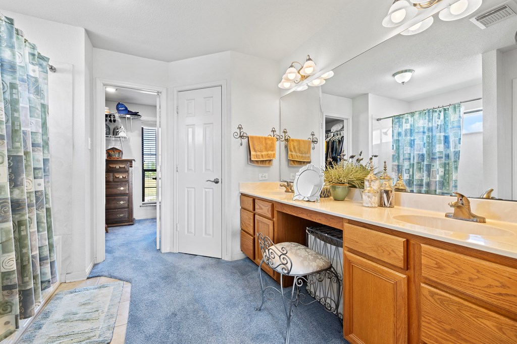 564 Gypsum Mine Road Fredericksburg, TX 78624 - Photo 7 of 20 a spacious bathroom with a sink double vanity granite and a mirror