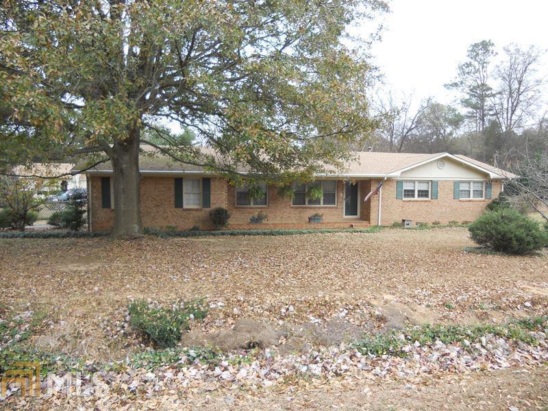 8 Marlynn Drive Northeast, Unit 7 Rome, GA 30161 - Photo 1 of 1 a front view of a house with a yard and garage