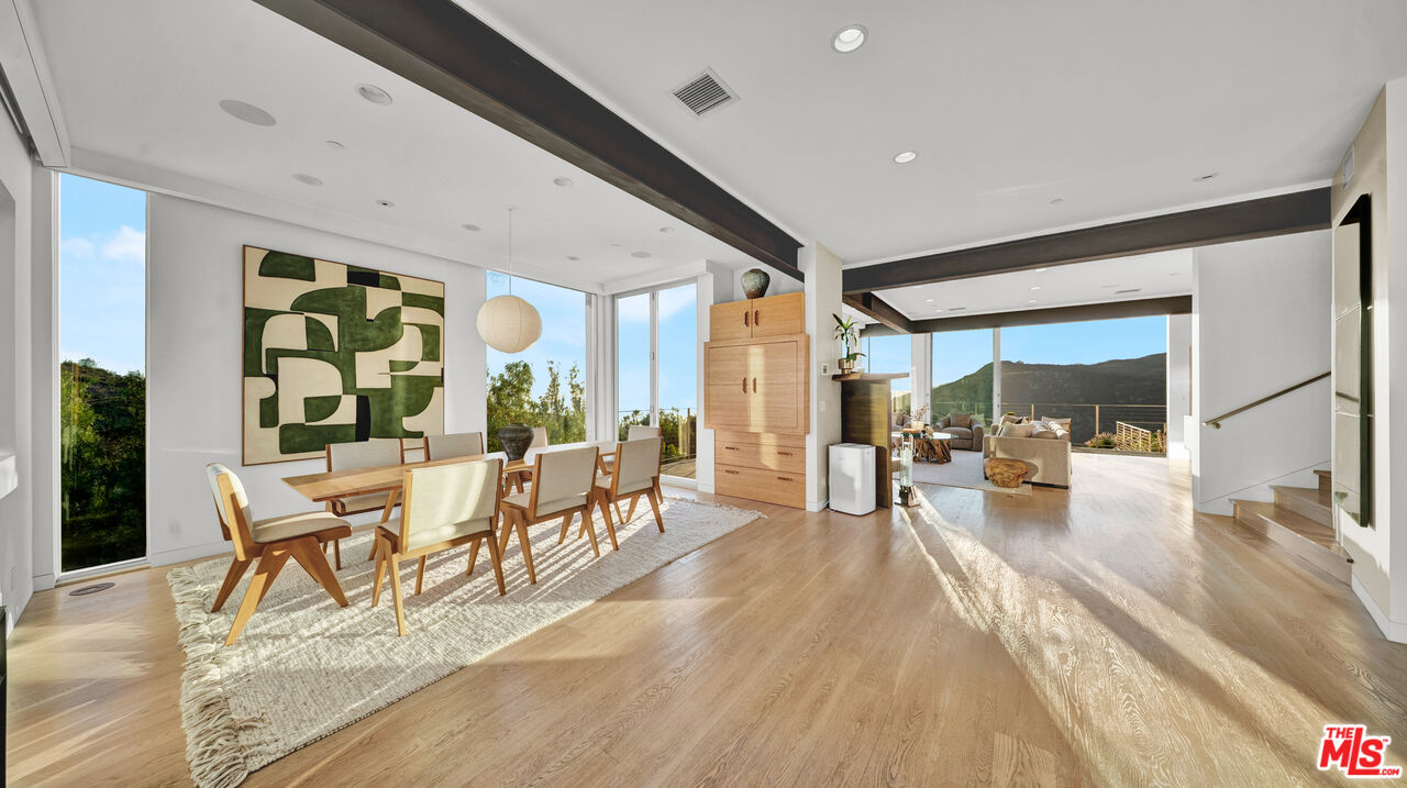 2915 Tuna Canyon Road Topanga, CA 90290 - Photo 3 of 45 a living room with furniture large window and wooden floor