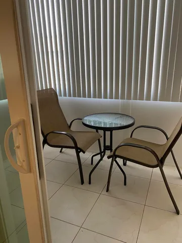 a view of a chairs and table in the terrace