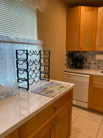 a kitchen with a sink a stove and a microwave