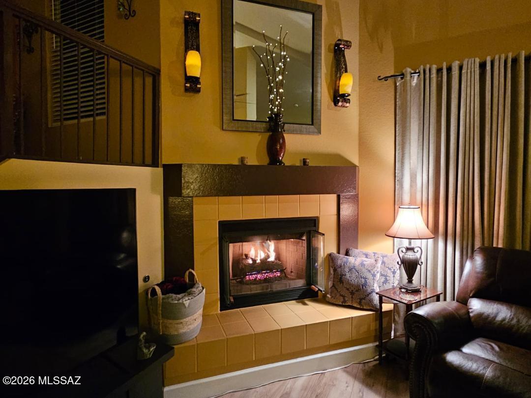 3130 West Star Ranch Trail Tucson, AZ 85742 - Photo 22 of 44 a living room with furniture and a fireplace