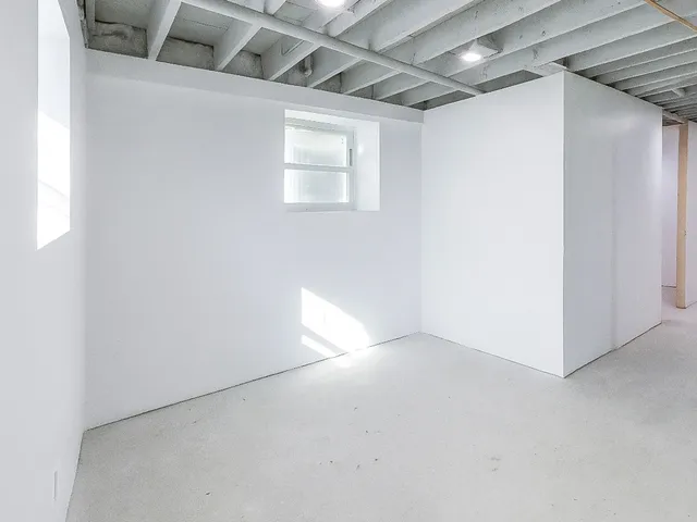 a view of a porch with wooden floor and fence