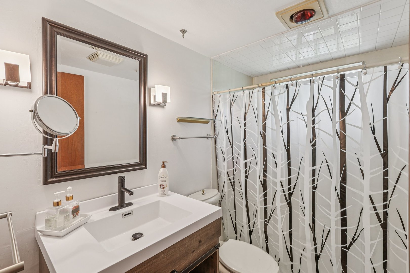 20214 Harmony Road Marengo, IL 60152 - Photo 13 of 56 a bathroom with a toilet sink and mirror
