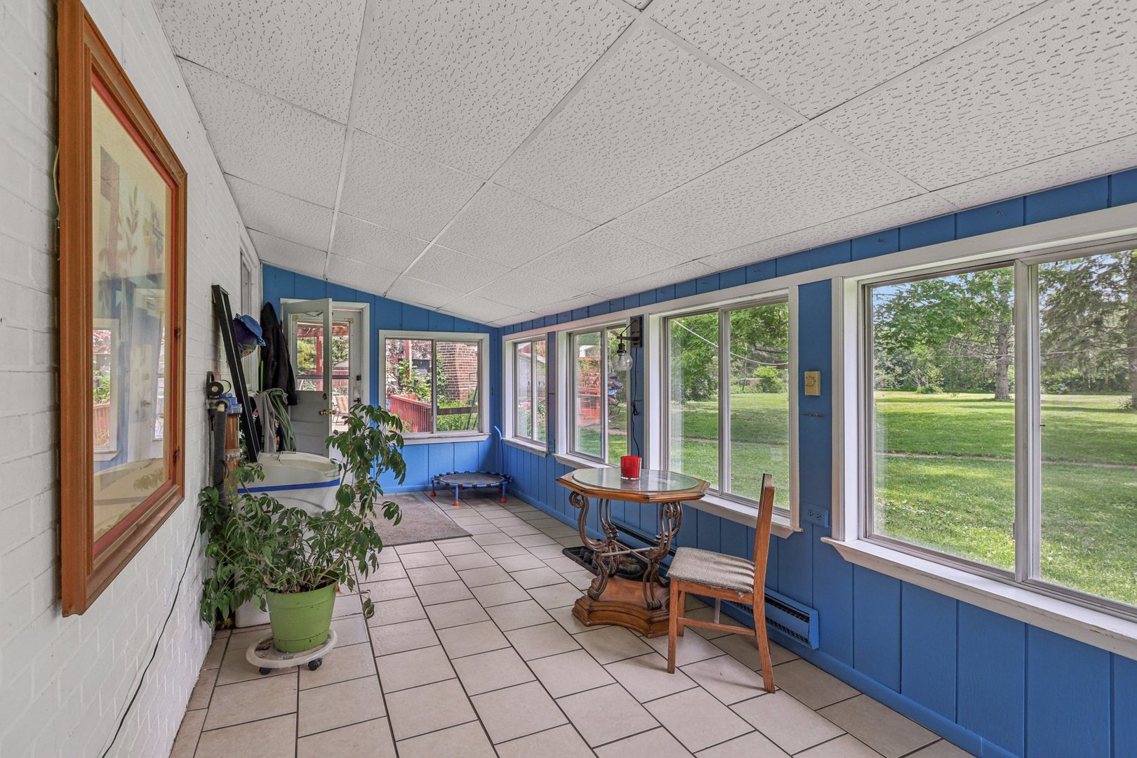 20214 Harmony Road Marengo, IL 60152 - Photo 17 of 56 a living room with furniture and large windows