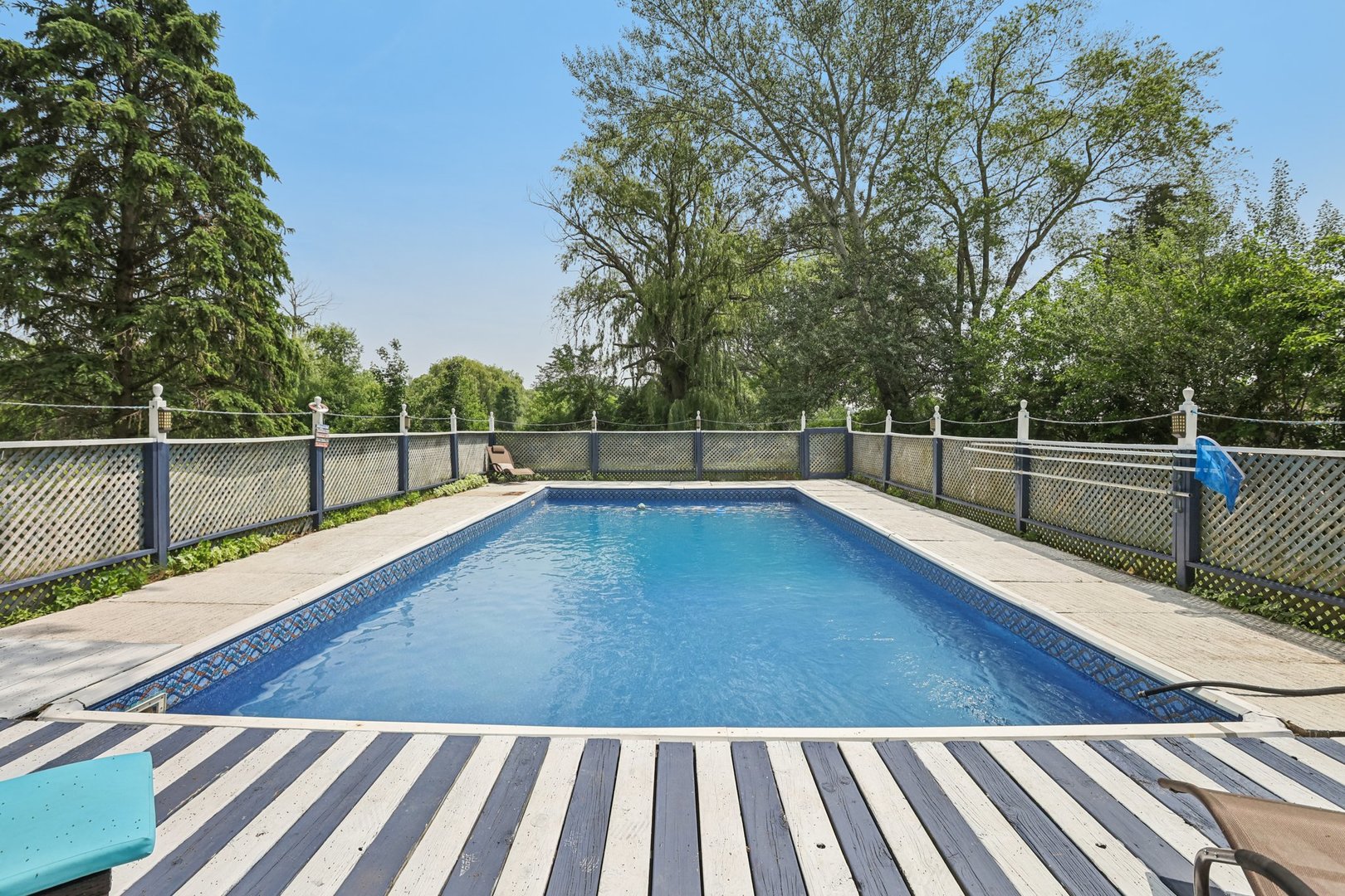 20214 Harmony Road Marengo, IL 60152 - Photo 29 of 56 a view of a tennis court with lots of trees in the background