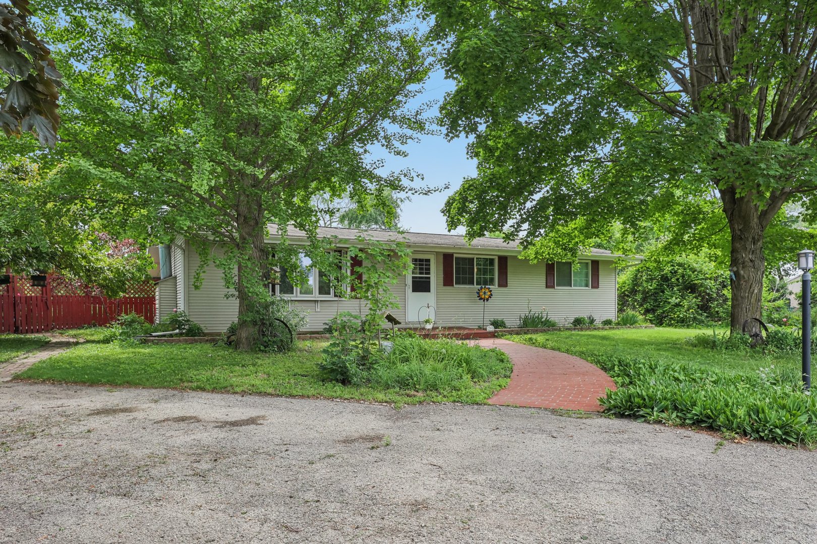 20214 Harmony Road Marengo, IL 60152 - Photo 37 of 56 a front view of a house with garden