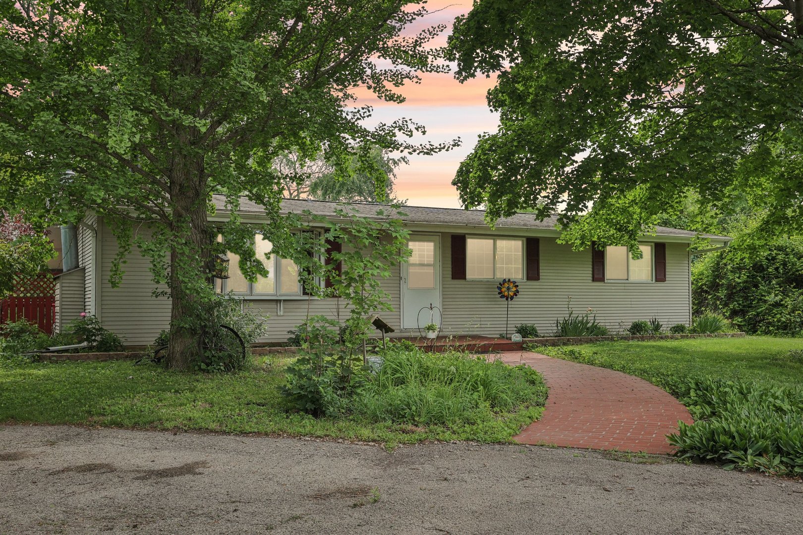 20214 Harmony Road Marengo, IL 60152 - Photo 40 of 56 a front view of a house with garden