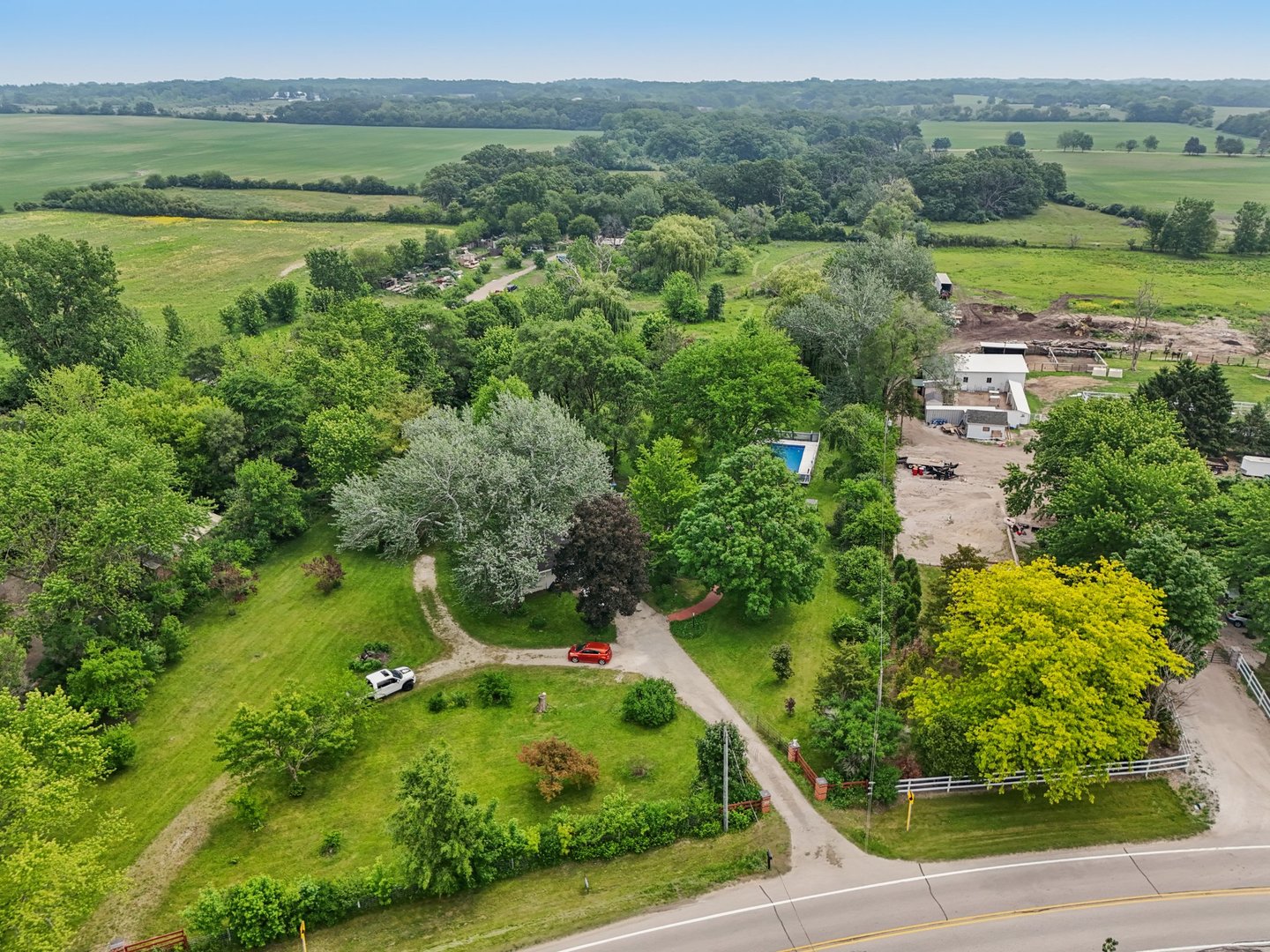 20214 Harmony Road Marengo, IL 60152 - Photo 46 of 56 an aerial view of residential houses with outdoor space and trees