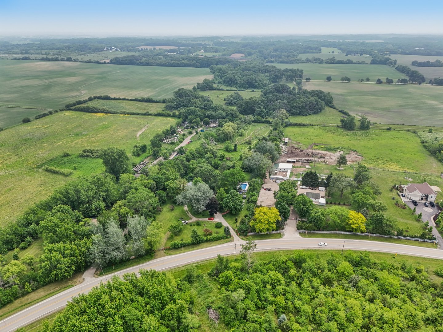 20214 Harmony Road Marengo, IL 60152 - Photo 52 of 56 an aerial view of a houses with outdoor space and river