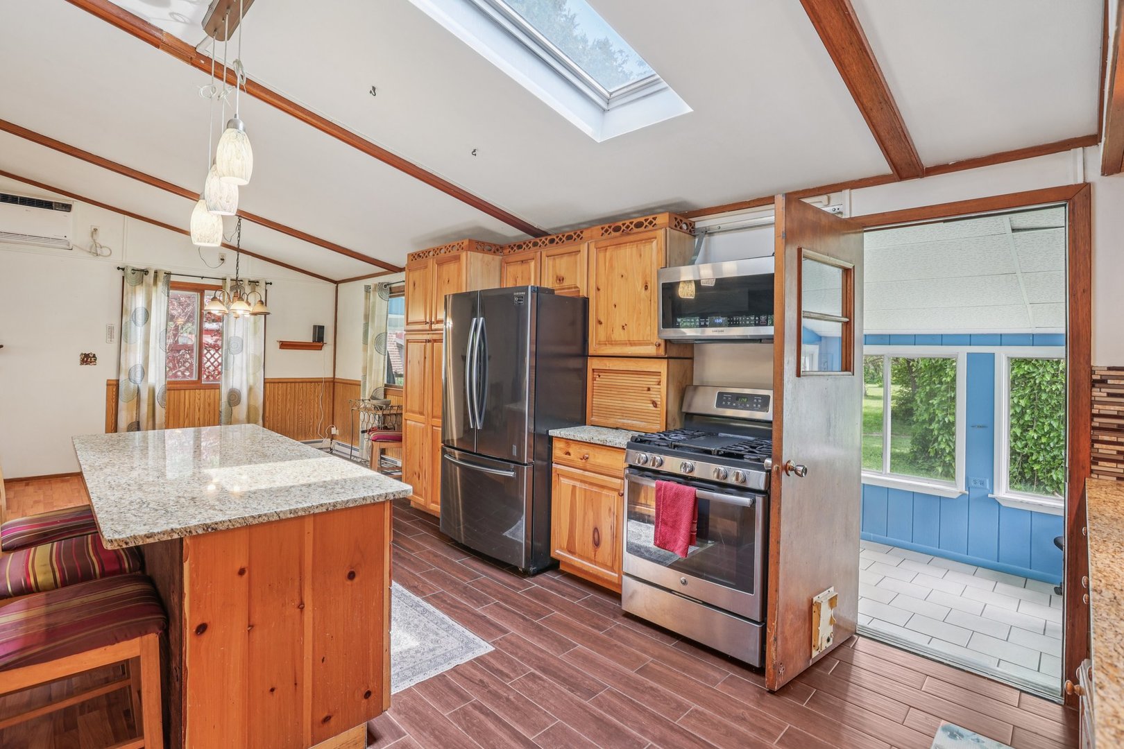 20214 Harmony Road Marengo, IL 60152 - Photo 10 of 56 a kitchen with stainless steel appliances granite countertop a refrigerator a stove and a wooden floors