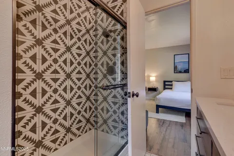 a en suite bathroom with a toilet and a shower curtain